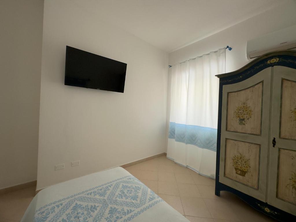 Een bed of bedden in een kamer bij Garden Hotel Alghero
