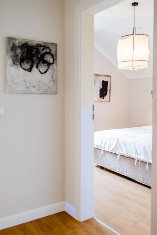 Postel nebo postele na pokoji v ubytování Aarskogs Boutique Hotel