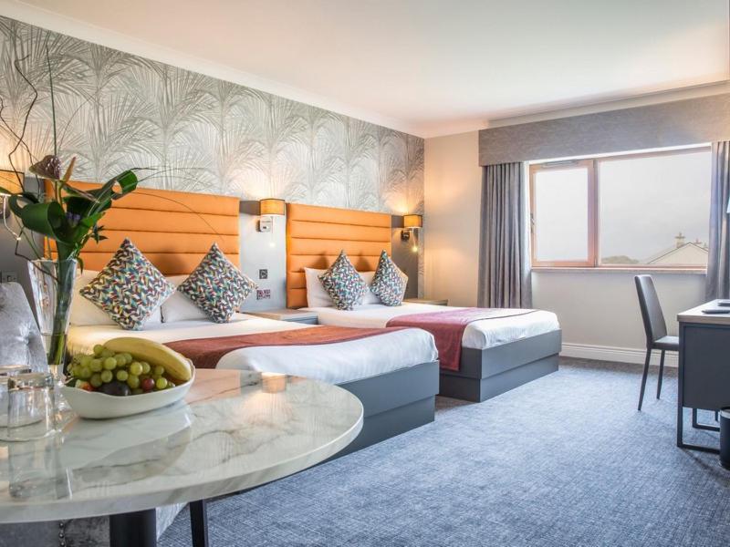 Postel nebo postele na pokoji v ubytování Diamond Coast Hotel