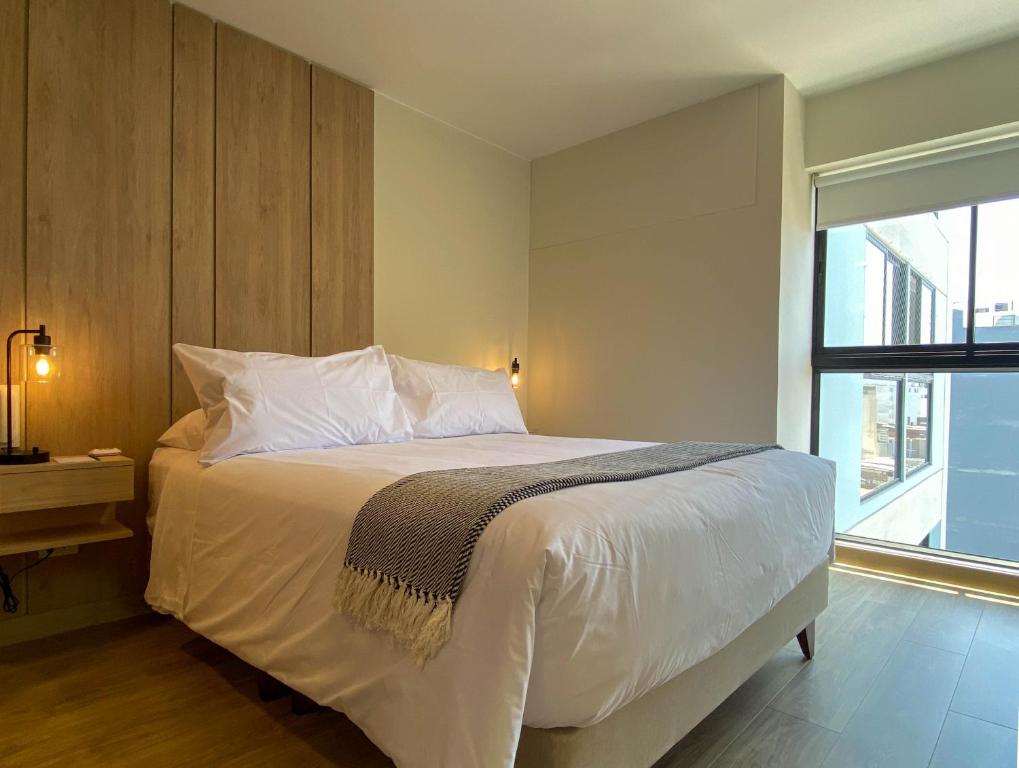 Postel nebo postele na pokoji v ubytování Pod by Wynwood House