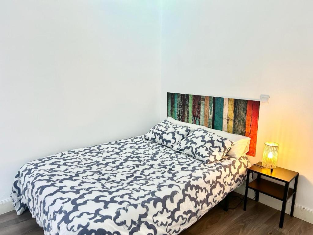 A bed or beds in a room at Madrid Rio Antonio Lopez A