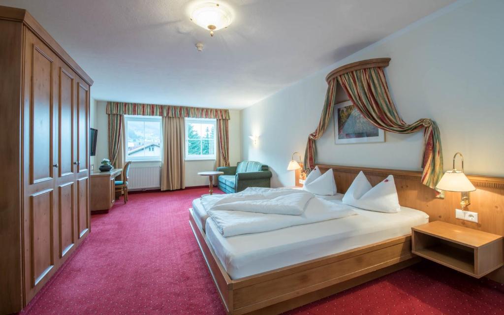 Łóżko lub łóżka w pokoju w obiekcie Vital Hotel Ortlerspitz