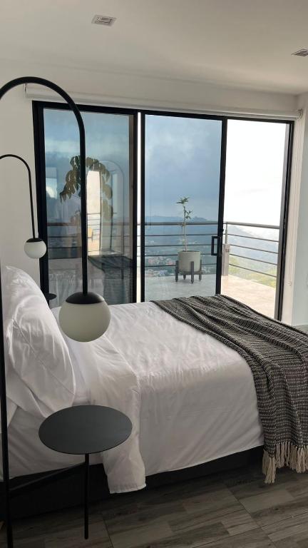 Postel nebo postele na pokoji v ubytování Hotel Villa Del Sol