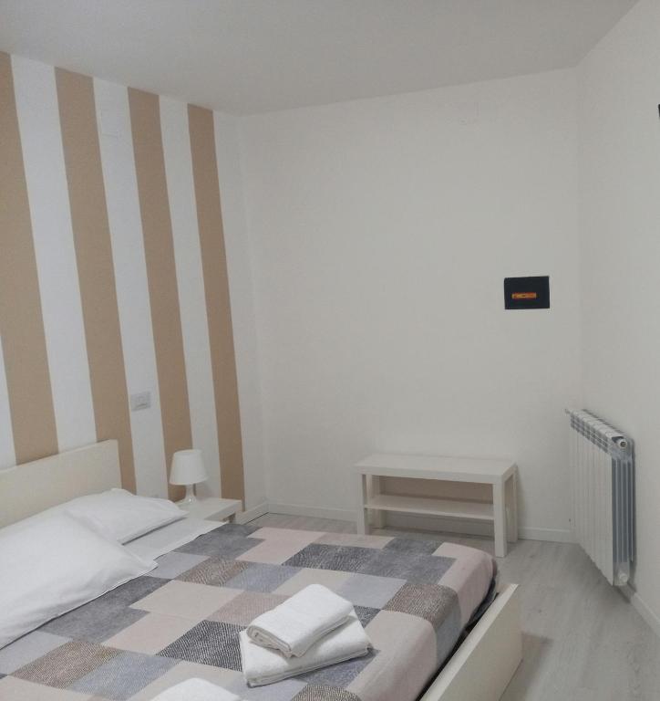 Postel nebo postele na pokoji v ubytování Dalle Zie B&B