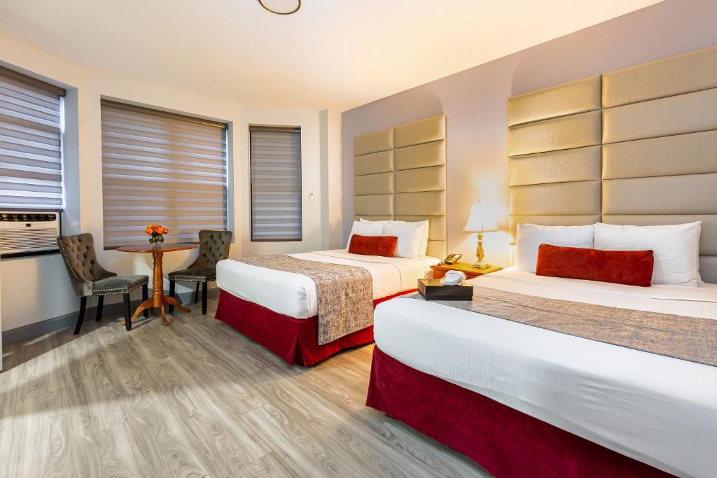 Postel nebo postele na pokoji v ubytování Hotel St. James