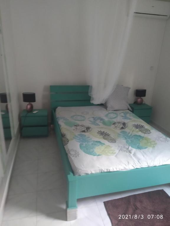Кровать или кровати в номере Magnifique appartement 15 minutes de Fort de France