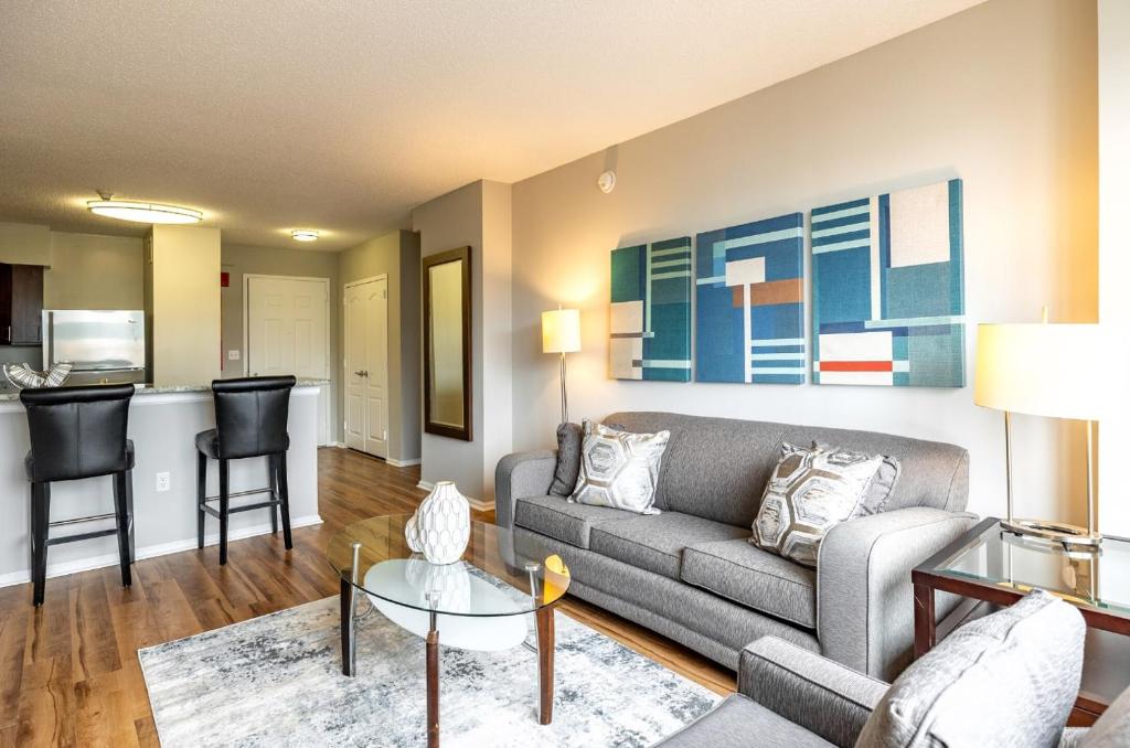 a living room with a couch and a table at Modern & Spcaious Apt Near Downtown in White Plains