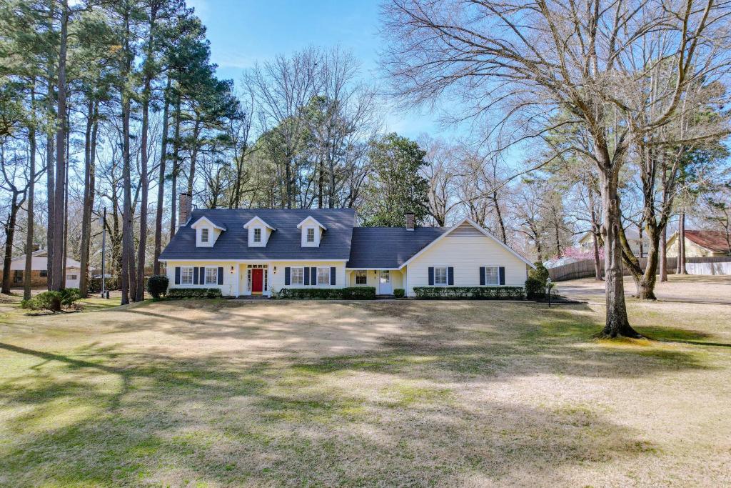 a large white house with a large yard at Expansive Texarkana Home with Yard Near Golf! in Texarkana