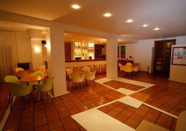 a dining room with tables and chairs in a room at Hanioti hotel in Hanioti