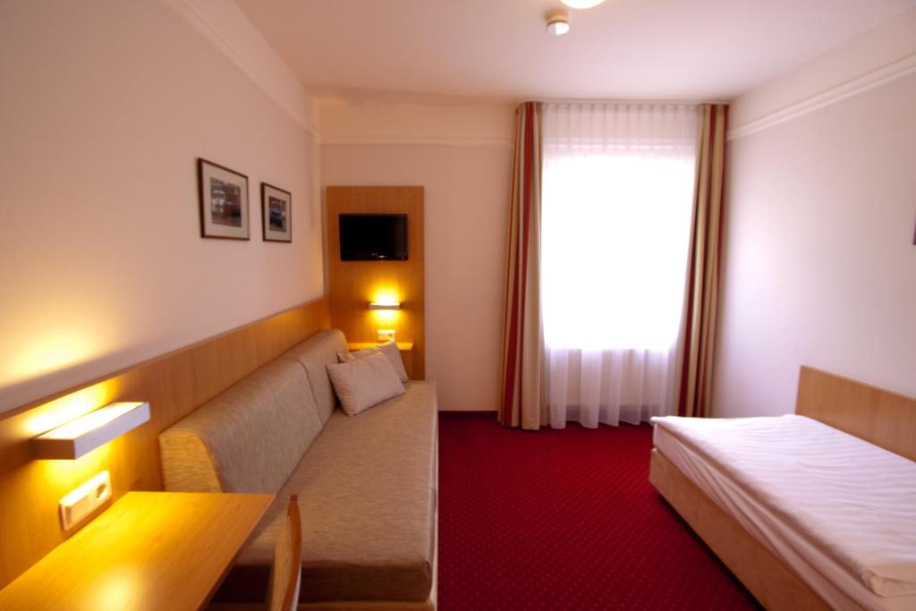 Postel nebo postele na pokoji v ubytování Hotel Jacobsberg