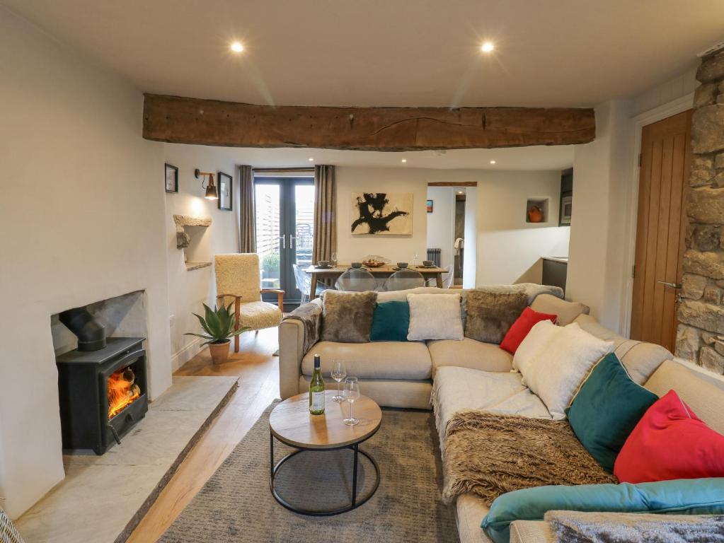 a living room with a couch and a fireplace at 4 Castle Terrace in Barnard Castle