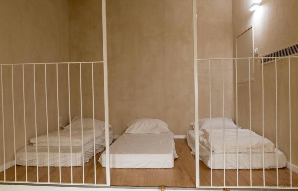 Postel nebo postele na pokoji v ubytování Hagafen Boutique Suites
