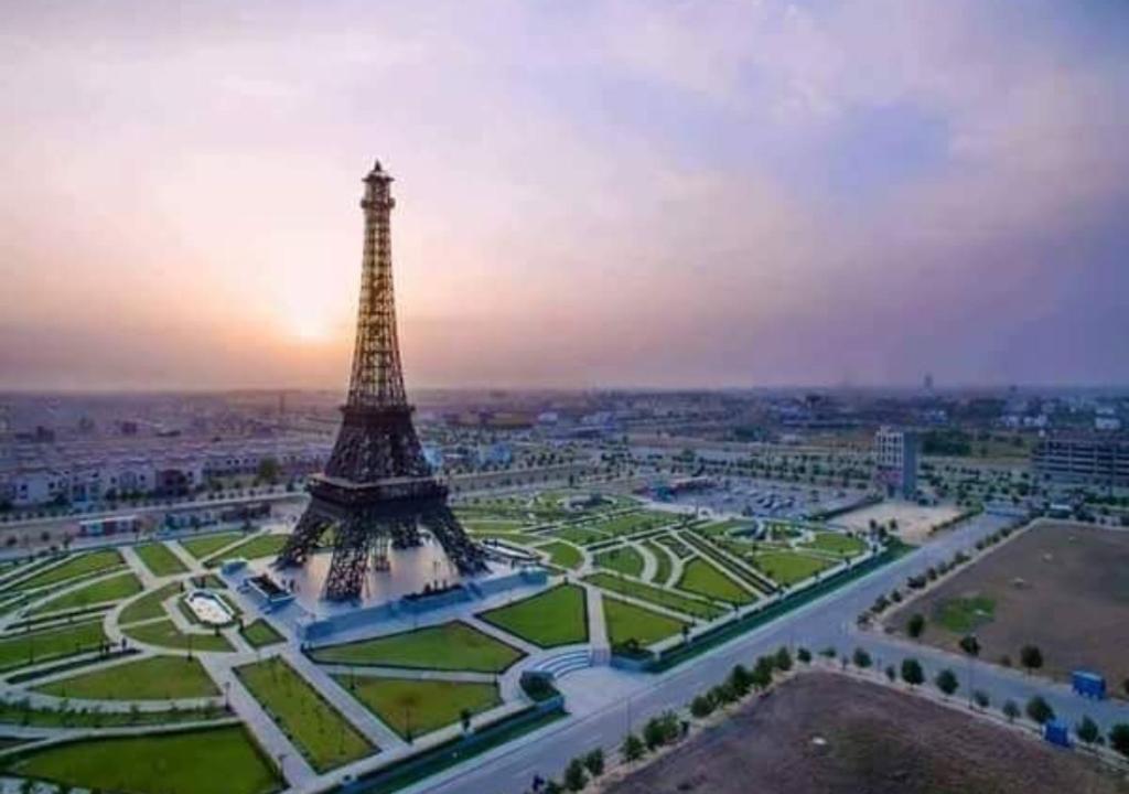 a view of the eiffel tower at sunset at Bahria Prime Apartments in Lahore