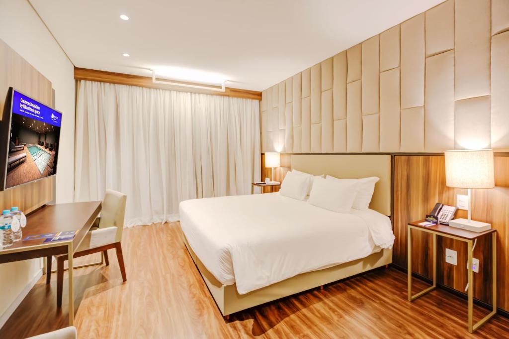 Postel nebo postele na pokoji v ubytování DoubleTree by Hilton - Resort - Foz do Iguaçu