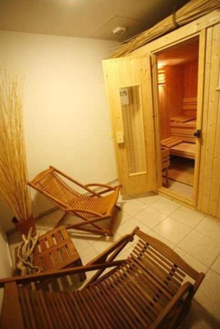 a room with two rocking chairs and a hallway at Hanioti hotel in Hanioti