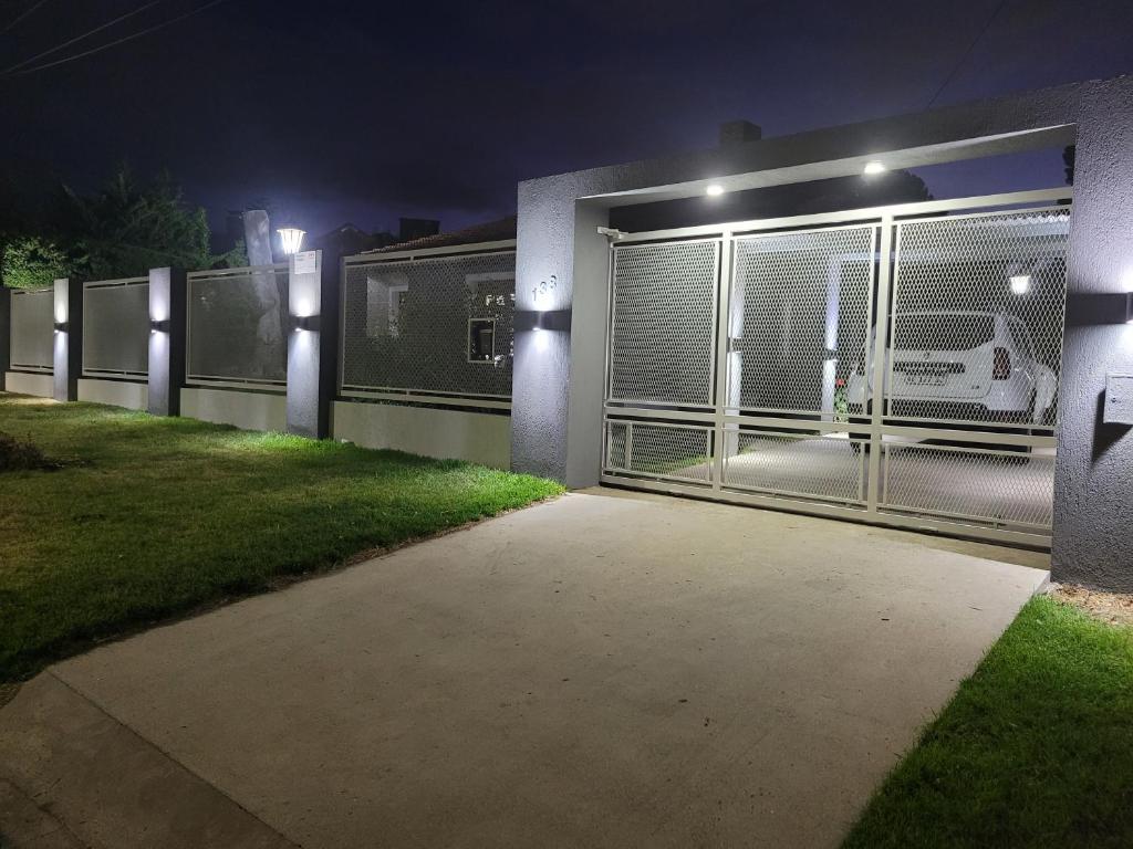 a garage at night with a car parked inside at BAHIA BLANCA-BARRIO PARQUE in Bahía Blanca