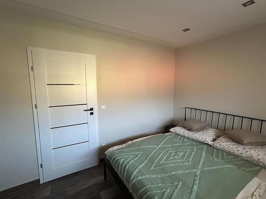 Ein Bett oder Betten in einem Zimmer der Unterkunft Apartament Dzień Dobry