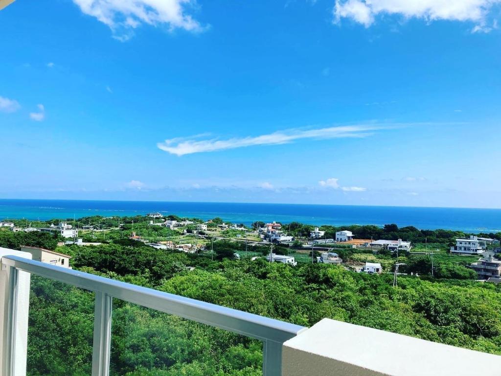 a view of the ocean from the balcony of a condo at Condominium Hotel Okinawa Yumeto - Vacation STAY 16578v in Nanjo