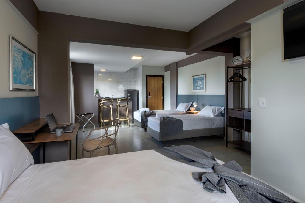 Postel nebo postele na pokoji v ubytování Lym Flat Hotel