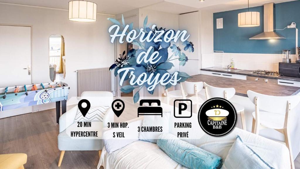 een woonkamer met een bank met een bord dat horizon die bloemen leest bij Horizon de Troyes - 3 chambres TV - Parking Privé in Troyes