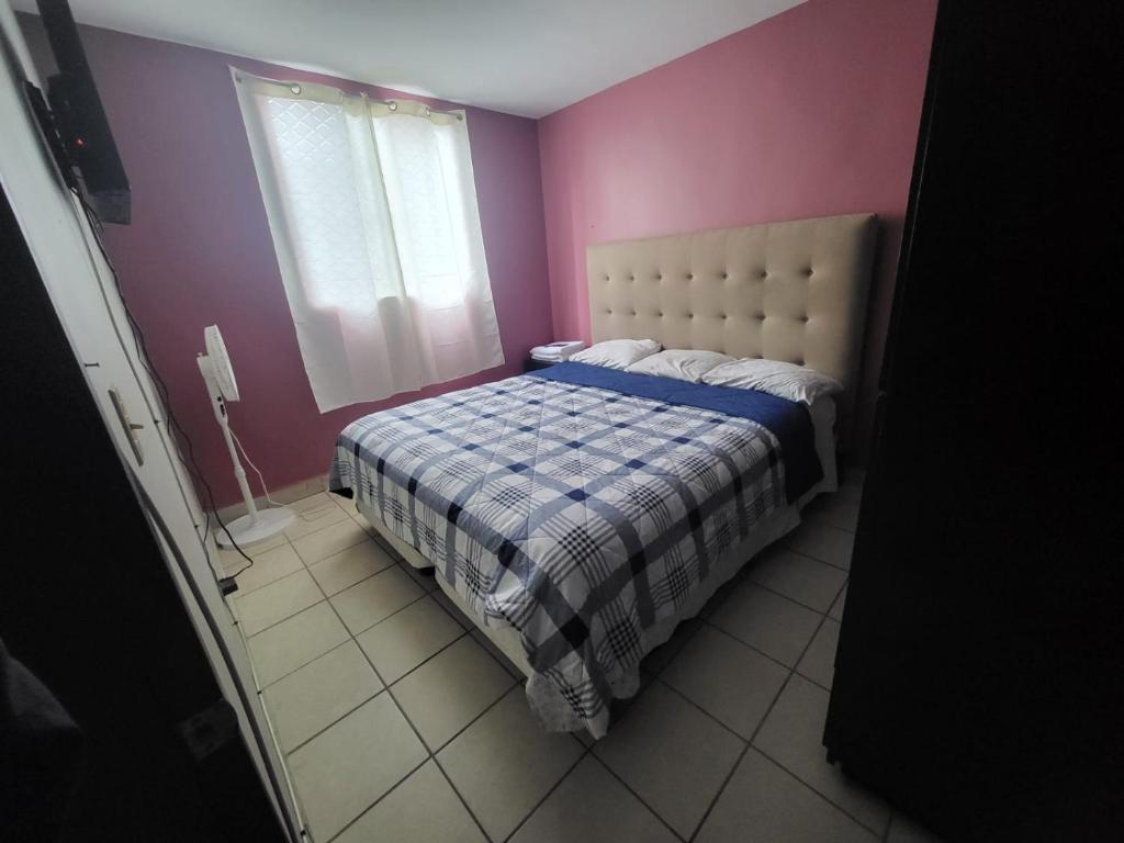 Postel nebo postele na pokoji v ubytování Departamentos Velasco Recamaras