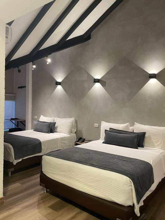 Postel nebo postele na pokoji v ubytování Hotel Santiago de Arma