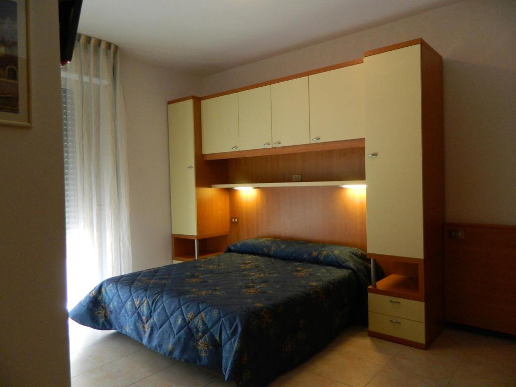 Postel nebo postele na pokoji v ubytování Hotel Kennedy