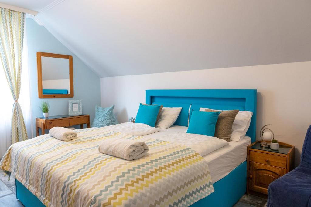 A bed or beds in a room at Balaton Fantasy Villa