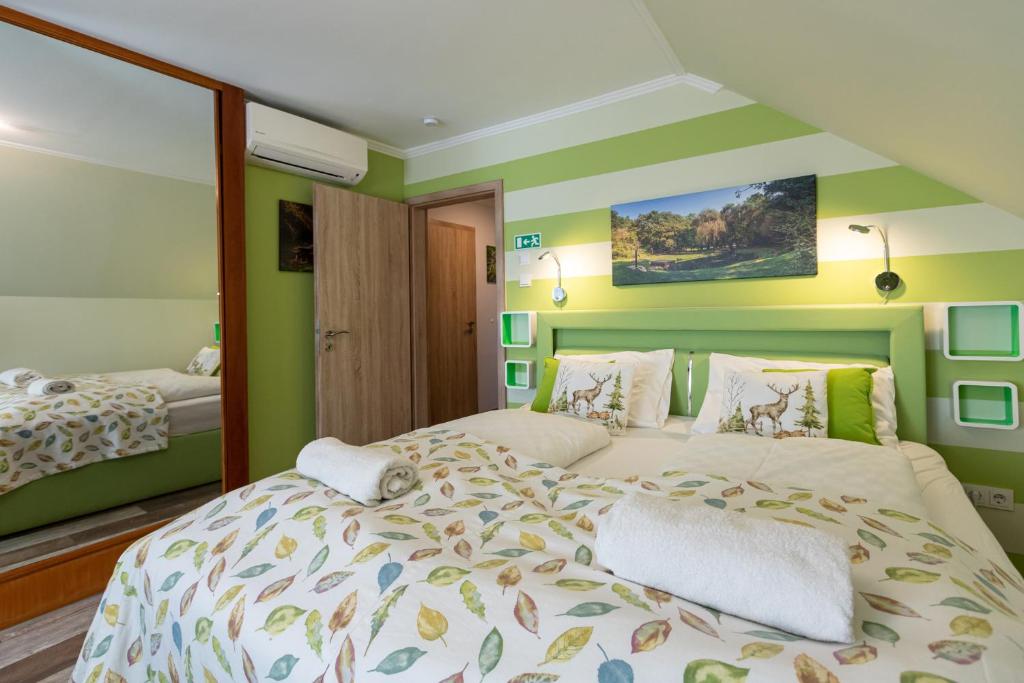 A bed or beds in a room at Balaton Fantasy Villa