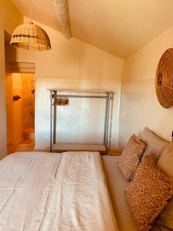 Postel nebo postele na pokoji v ubytování Le Vieux Portail