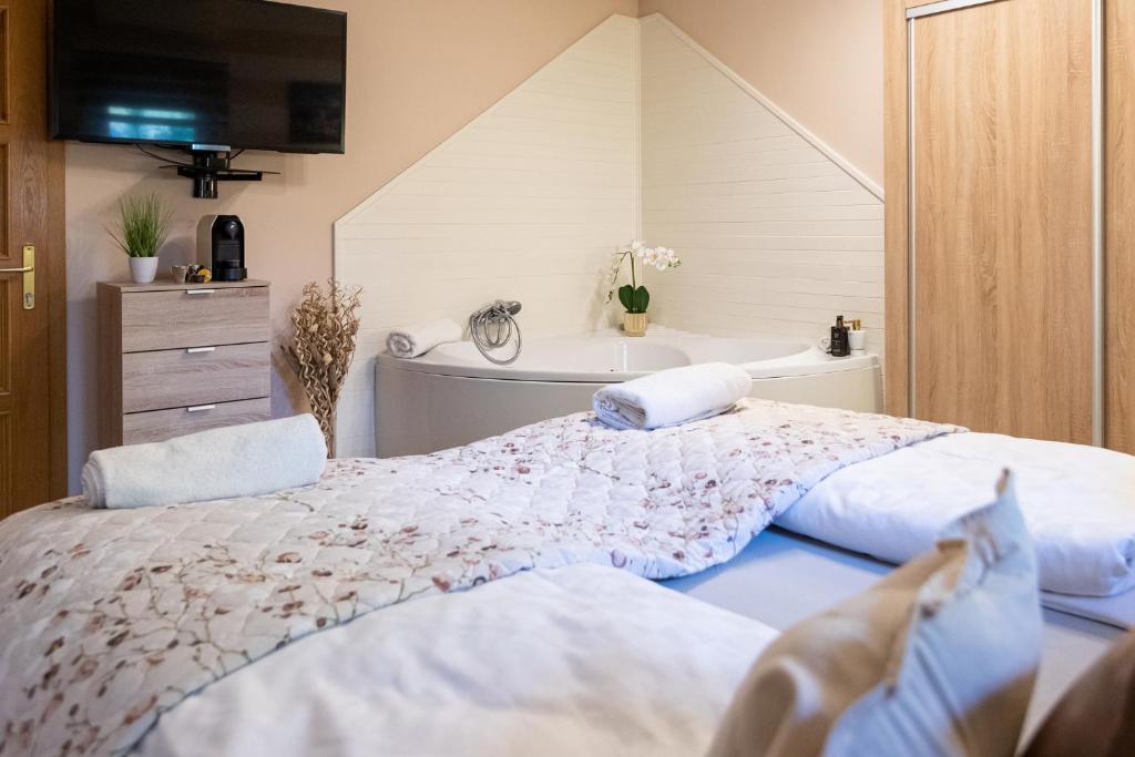 A bed or beds in a room at Balaton Fantasy Villa