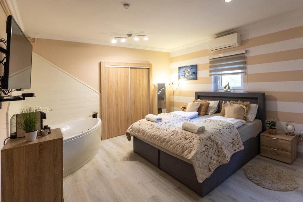 A bed or beds in a room at Balaton Fantasy Villa