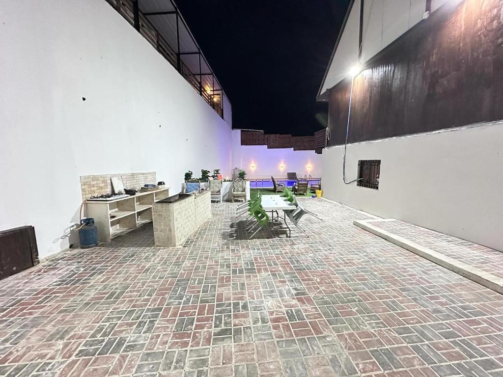 an empty room with tables and chairs in a building at Jericho Palestine, Panorama Villa- View, Full Privacy & Pool in Jericho
