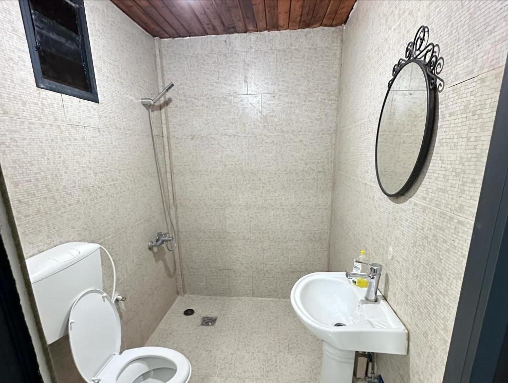 a bathroom with a toilet and a sink at Jericho Palestine, Panorama Villa- View, Full Privacy & Pool in Jericho