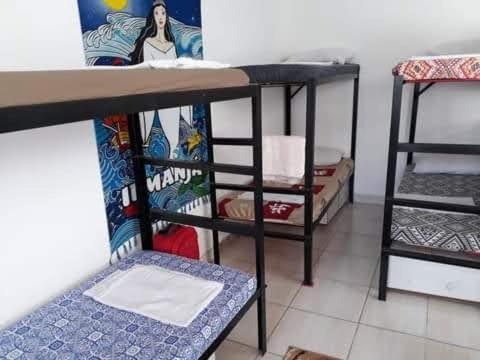 Postel nebo postele na pokoji v ubytování hostel quintal da sereia