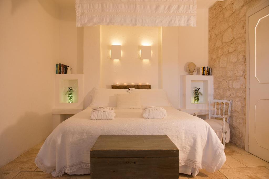 Postel nebo postele na pokoji v ubytování Masseria Salinola