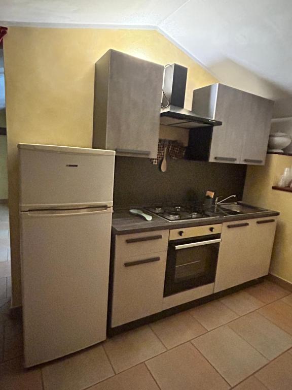 Kuchyň nebo kuchyňský kout v ubytování La Perla di Assisi