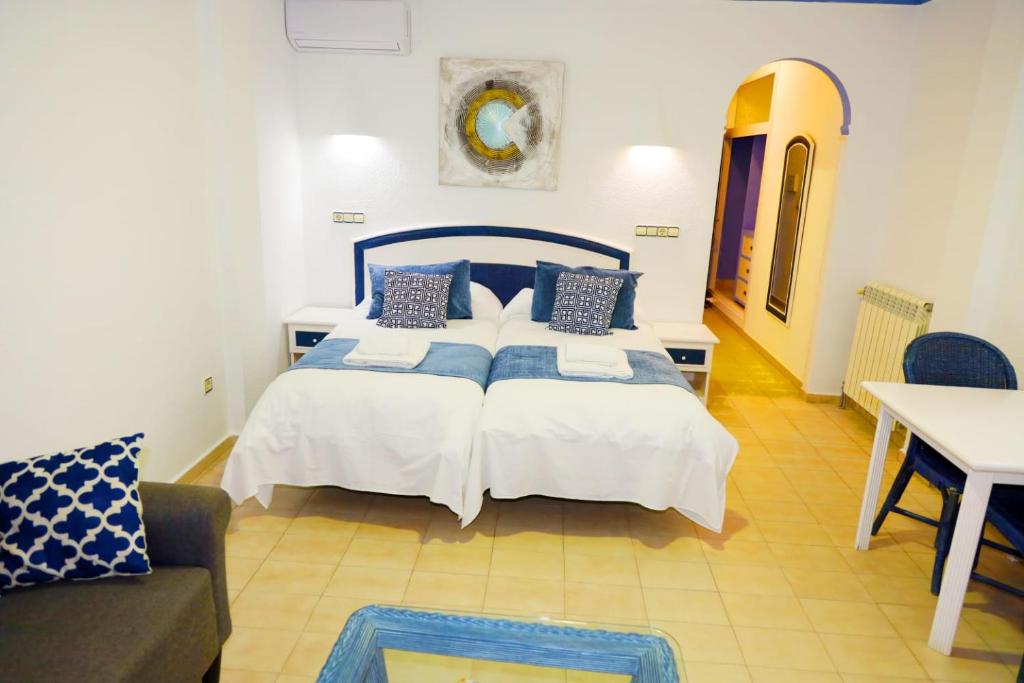 Postel nebo postele na pokoji v ubytování Hotel Marazul