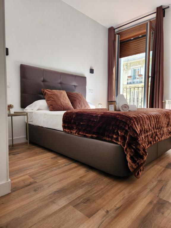 Postel nebo postele na pokoji v ubytování Hostal Arenal Madrid
