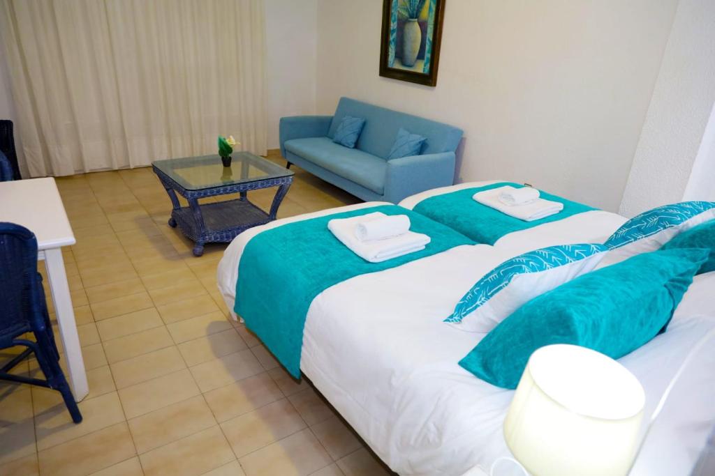 Postel nebo postele na pokoji v ubytování Hotel Marazul