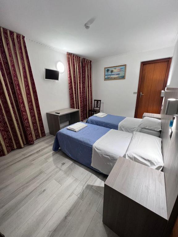 Postel nebo postele na pokoji v ubytování Taverna Dantesca