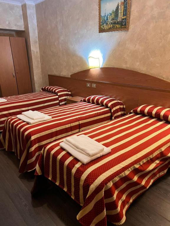 Postel nebo postele na pokoji v ubytování Taverna Dantesca