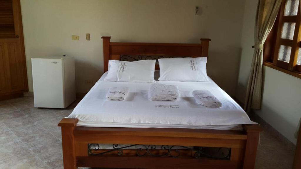 Postel nebo postele na pokoji v ubytování Hotel Tamarindo Resort