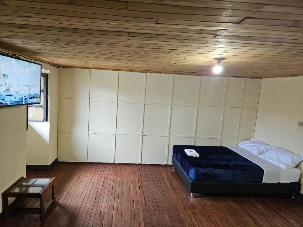 Tempat tidur dalam kamar di Casa Guicán