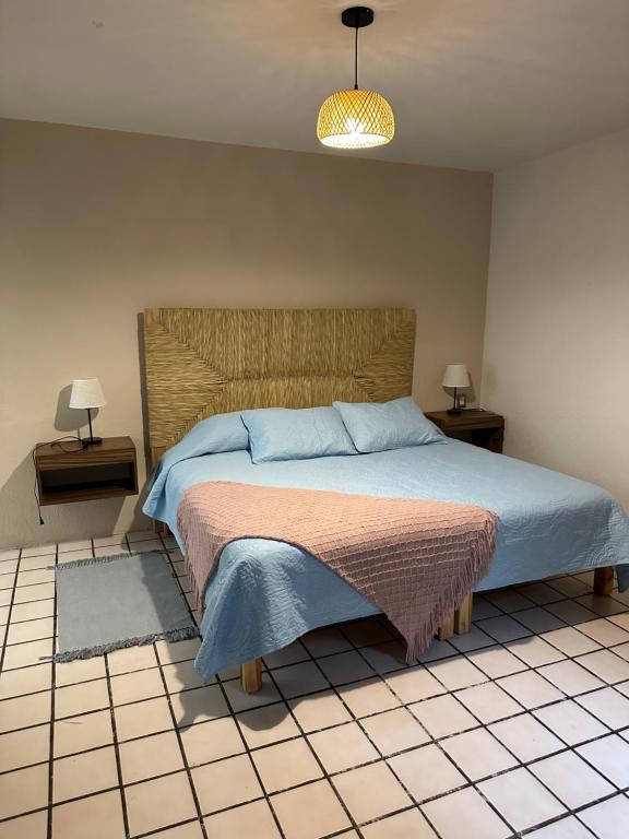 Postel nebo postele na pokoji v ubytování Casa de Maria