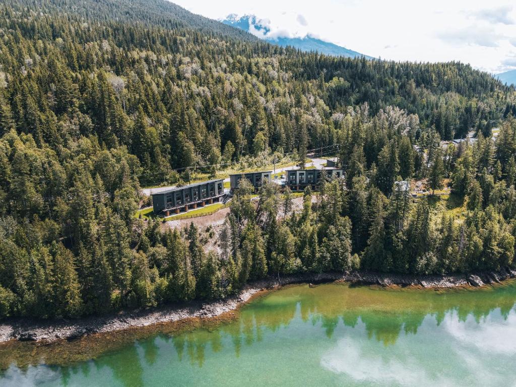 an aerial view of a building next to a lake at Basecamp Resorts Revelstoke in Revelstoke