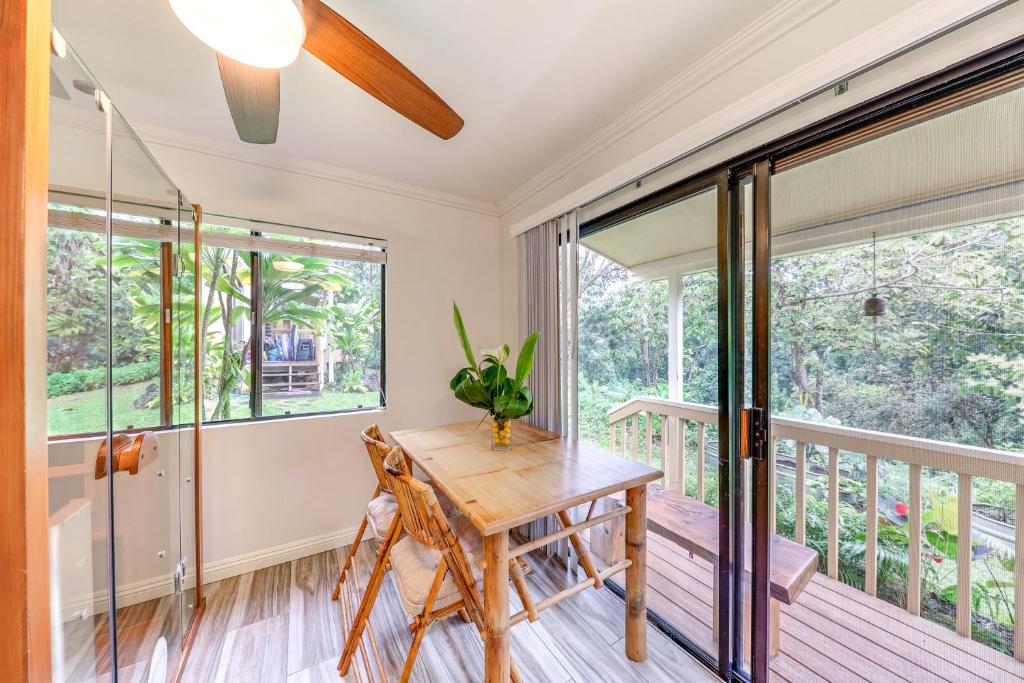 a dining room with a table and a balcony at Princeville Condo with Private Sauna about 2 Mi to Beach in Princeville