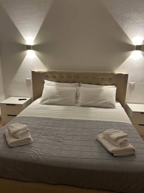 מיטה או מיטות בחדר ב-Manarola apartament