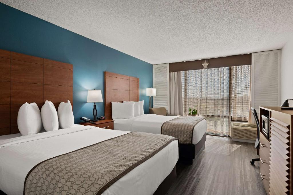 Postel nebo postele na pokoji v ubytování Best Western Orlando Gateway Hotel
