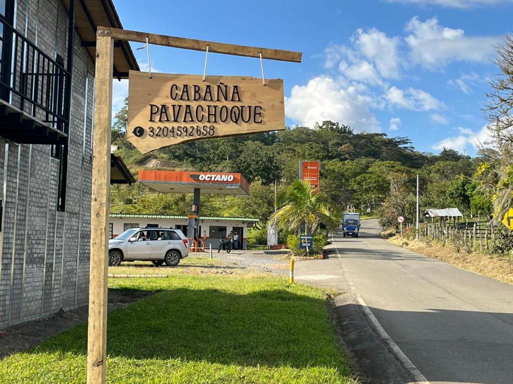a sign for aarmaarmaarmaarmaarmaote restaurant on a street at Cabaña Pavachoque in Puente Nacional